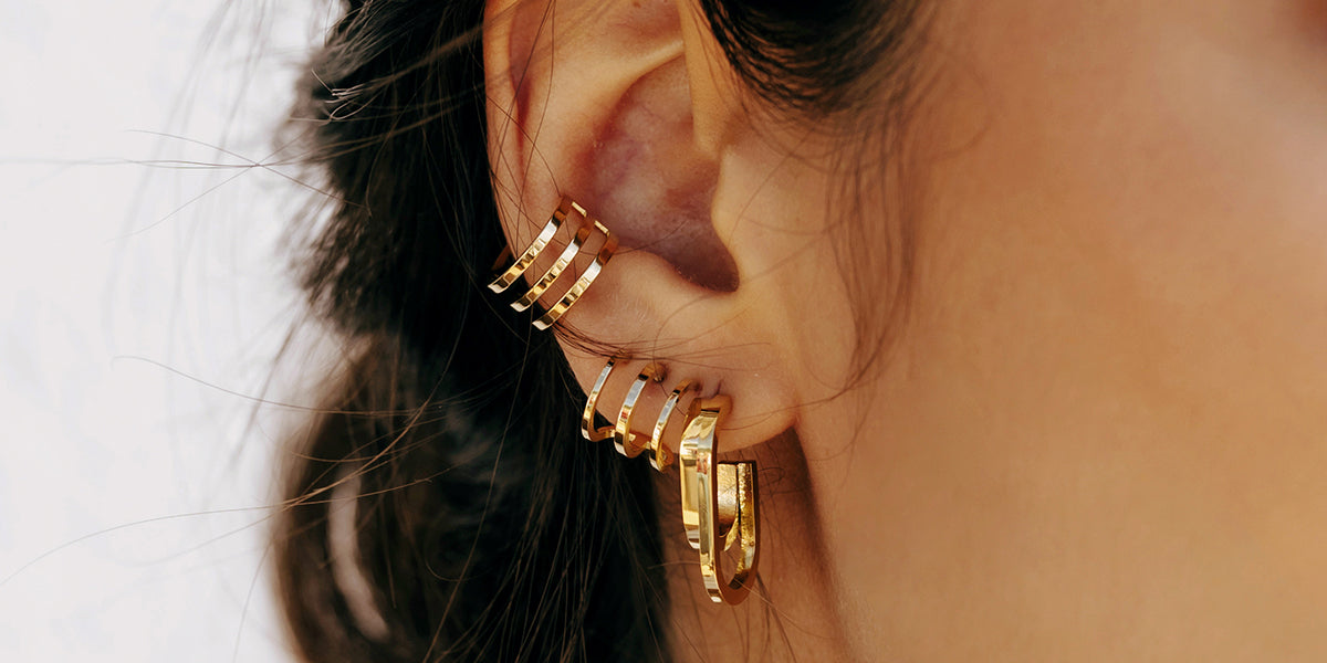 Comment porter l’accumulation de boucles d'oreilles ?